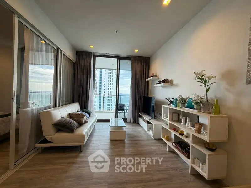 Modern living room with ocean view and stylish decor in high-rise apartment