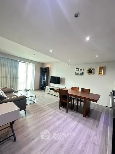 Spacious modern living room with elegant dining area and natural light