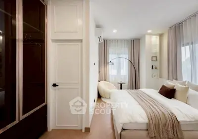 Luxurious modern bedroom with elegant decor and ample natural light