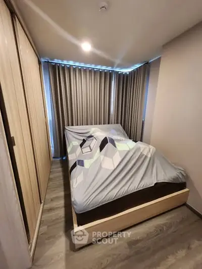 Modern bedroom with stylish decor and ample natural light