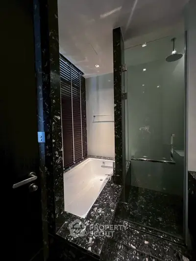 Luxurious bathroom with marble finishes and modern shower design