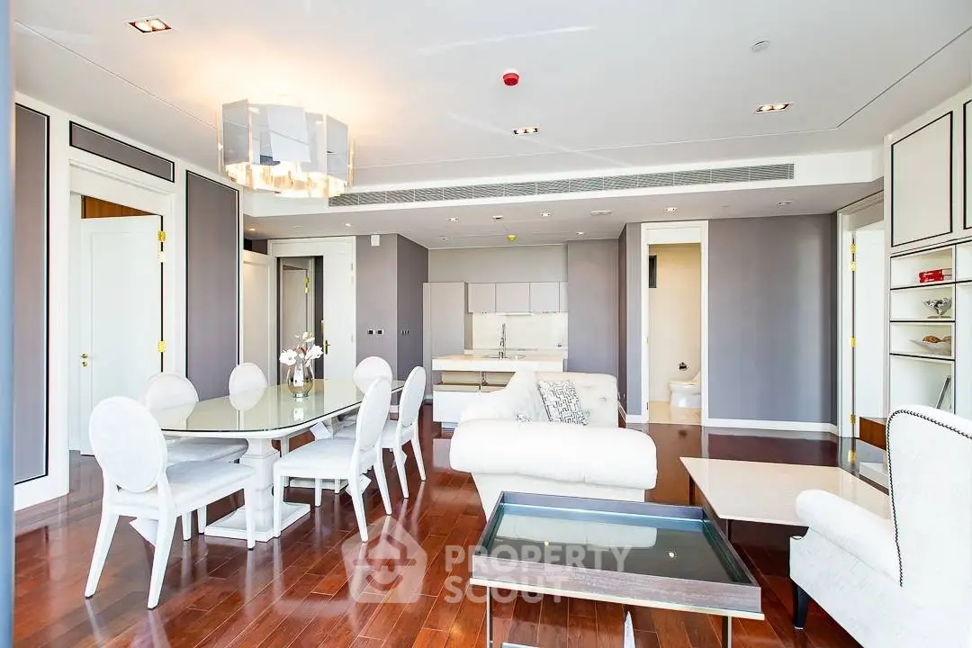 Luxurious open-plan living room with elegant dining area and modern decor
