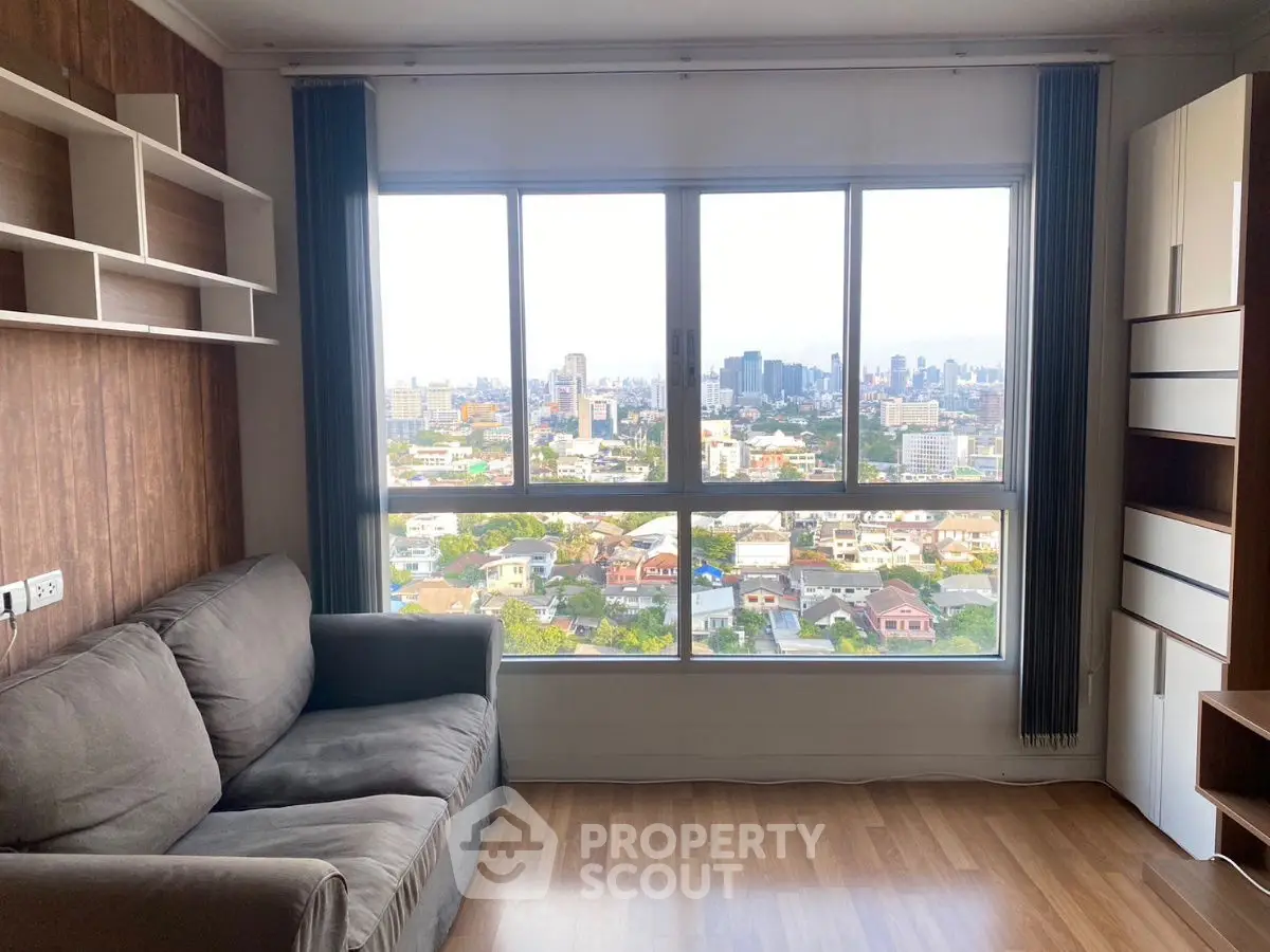 Spacious living room with stunning city view and modern furnishings