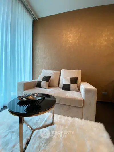 Luxurious living room with plush sofa and elegant decor, perfect for relaxation and comfort.