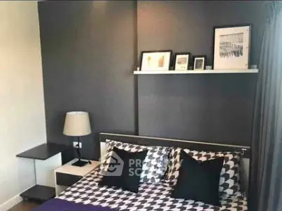Modern bedroom with stylish decor and geometric bedding