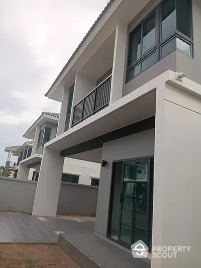 Modern two-story house with sleek design and spacious balcony