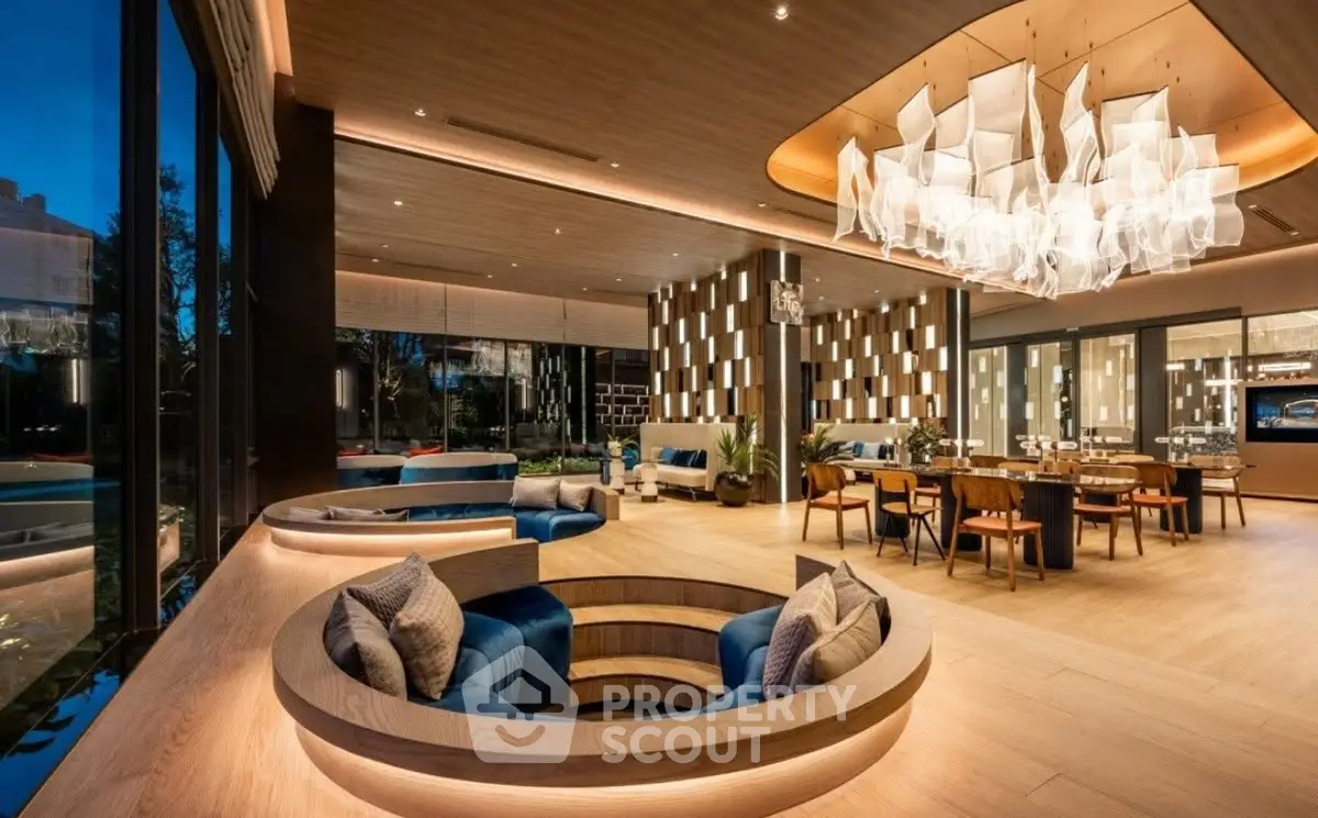 Luxurious modern living room with sunken seating and elegant chandelier