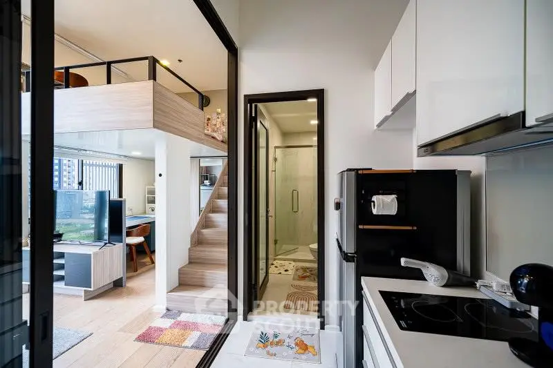 Modern loft apartment with open kitchen and stylish interior design