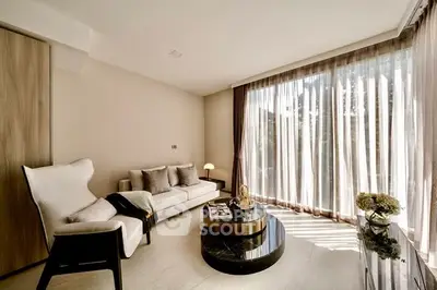 Elegant living room with floor-to-ceiling windows and modern decor