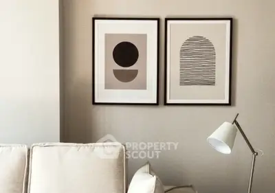 Modern living room with minimalist art and stylish lamp