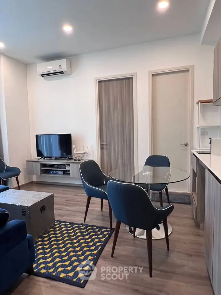 Modern living room with stylish furniture and open layout in contemporary apartment.