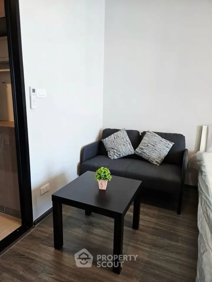 Cozy living area with modern sofa and table in stylish apartment