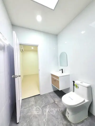 Modern bathroom with sleek design and elegant fixtures in a contemporary home.