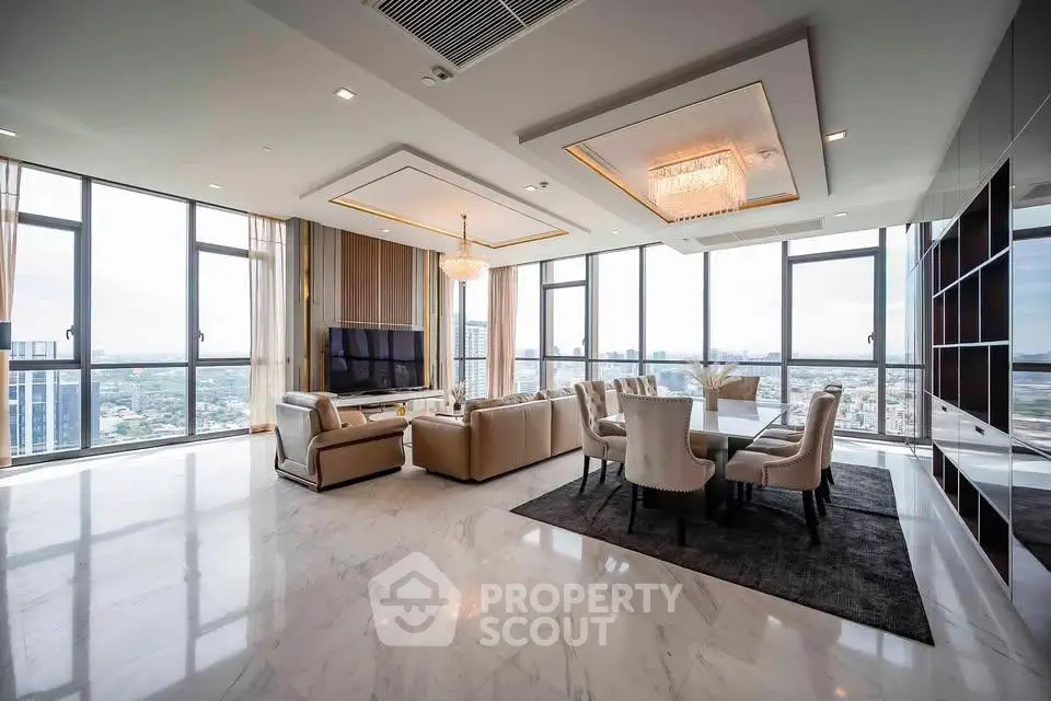 Luxurious high-rise living room with panoramic city views and elegant furnishings.
