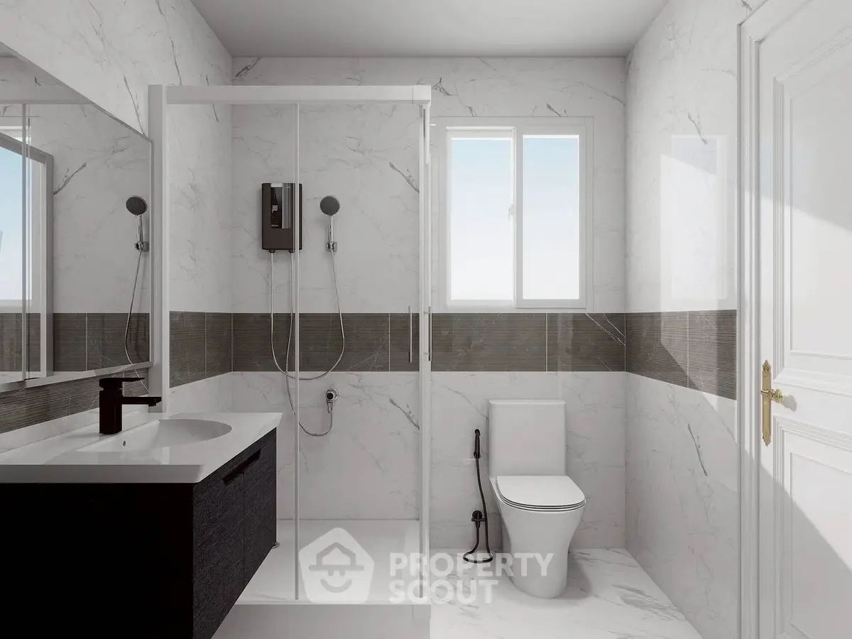 Modern bathroom with sleek shower and elegant marble tiles