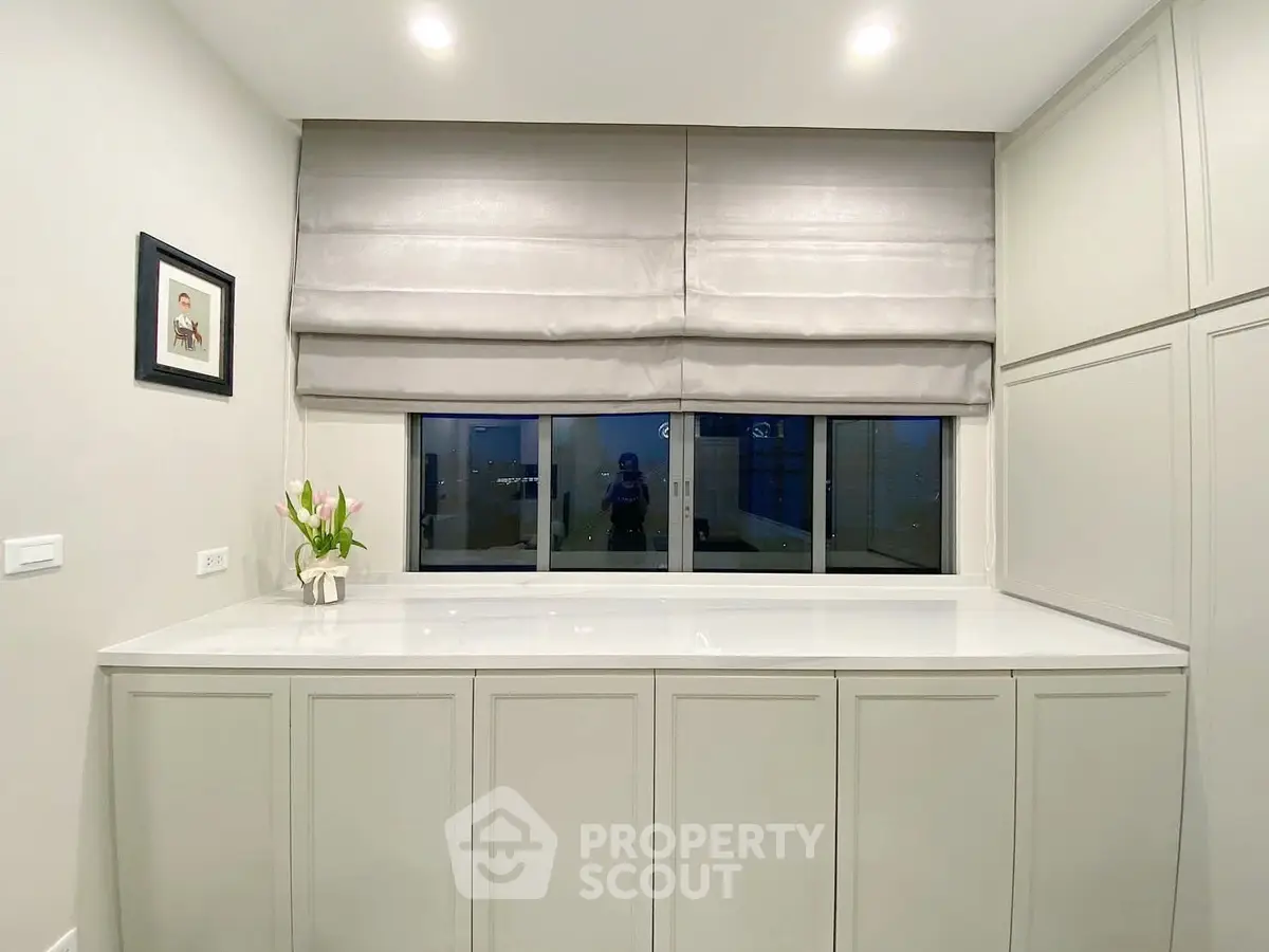 Elegant storage space with modern cabinetry and soft lighting