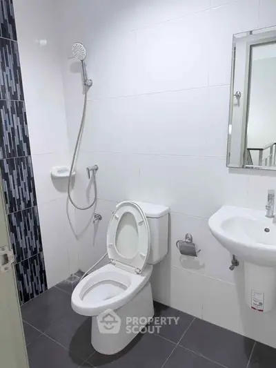 Modern bathroom with sleek fixtures and stylish tile accents