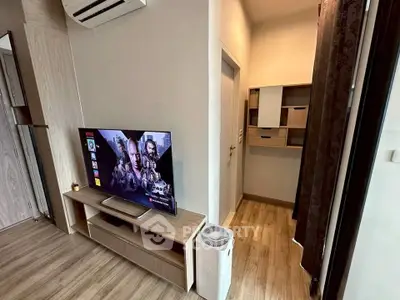 Modern living room with TV and air conditioning in stylish apartment
