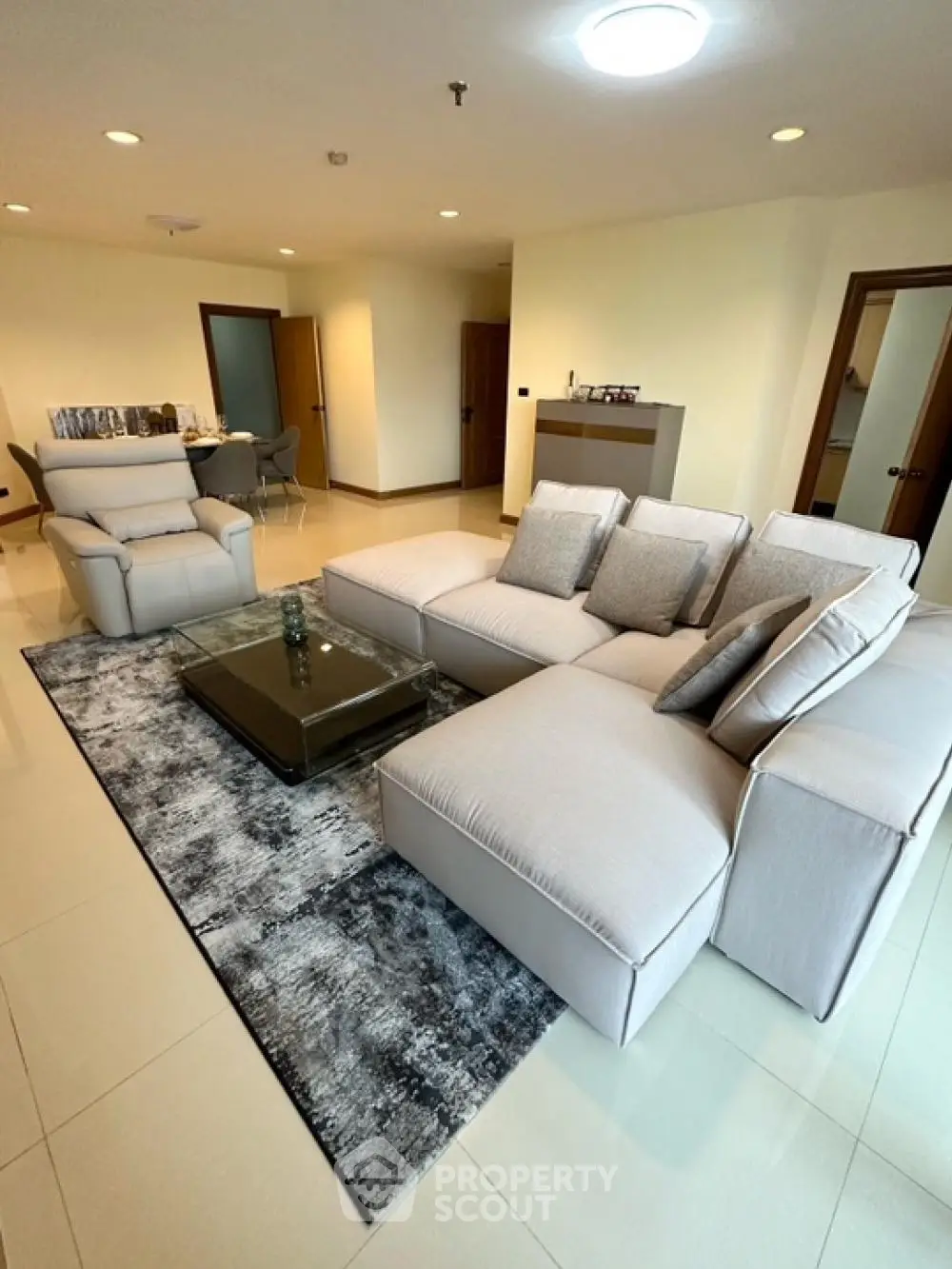 Spacious modern living room with plush sectional sofa and elegant decor
