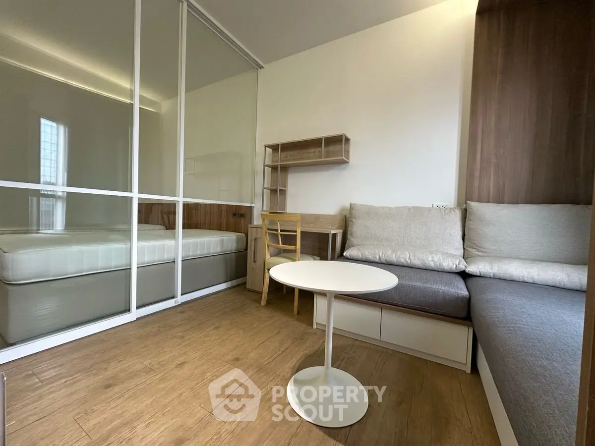 Modern compact living space with cozy seating and study area