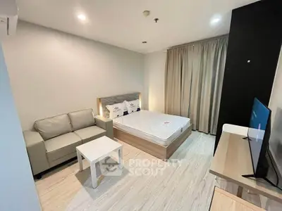 Modern bedroom with cozy sofa and stylish decor in a contemporary apartment