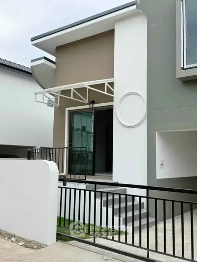 Modern townhouse exterior with sleek design and stylish entrance
