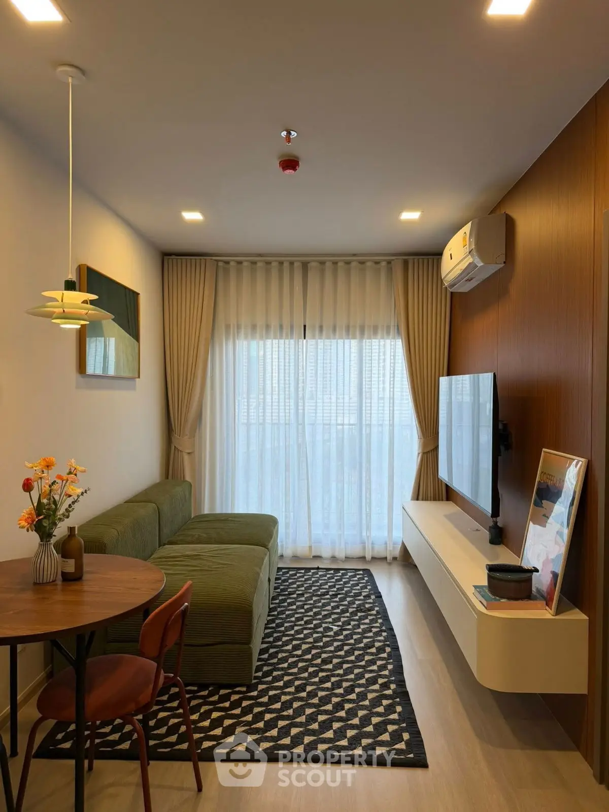 Modern living room with stylish decor and large window for natural light