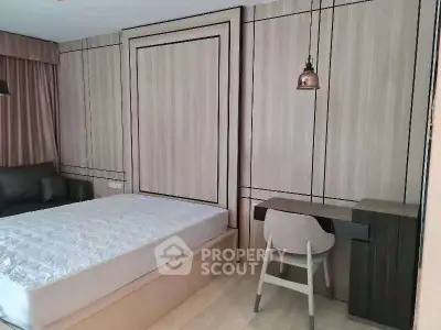 Modern bedroom with stylish wood paneling and cozy workspace