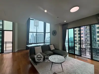 Spacious modern living room with city view and elegant furnishings