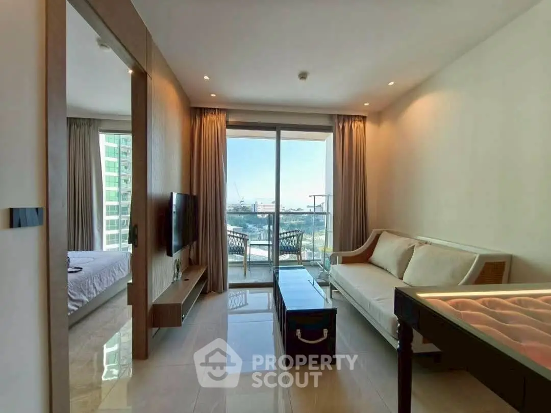 Modern living room with balcony view in high-rise apartment