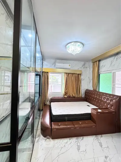 Luxurious bedroom with elegant leather bed and marble accents