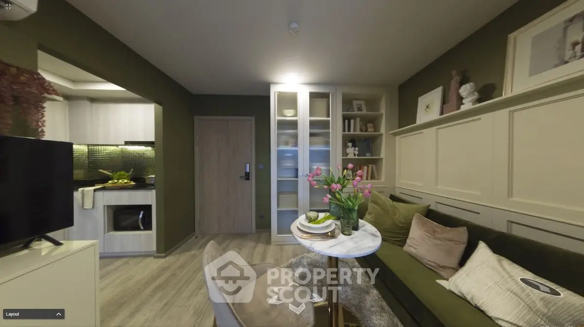 Stylish living room with modern decor and open kitchen layout in a cozy apartment.