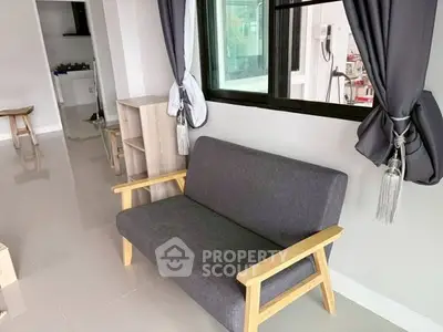 Modern living room with stylish sofa and sleek tiled flooring