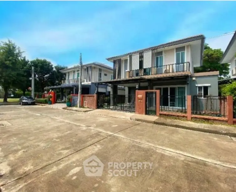 Charming suburban homes with modern design and spacious driveways in a peaceful neighborhood.