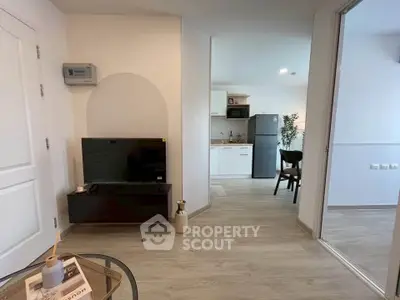 Modern open-plan living room with sleek kitchen and stylish decor