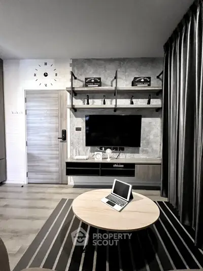 Modern living room with stylish decor and wall-mounted TV