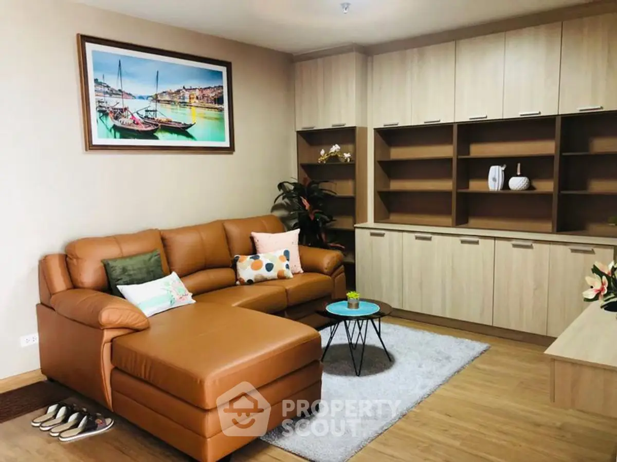 Stylish living room with leather sofa and modern shelving unit