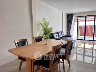 Spacious living room with elegant dining area and modern furniture