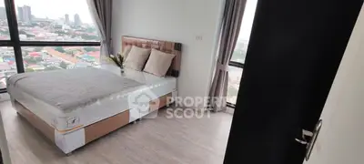 Modern bedroom with panoramic city view and stylish decor
