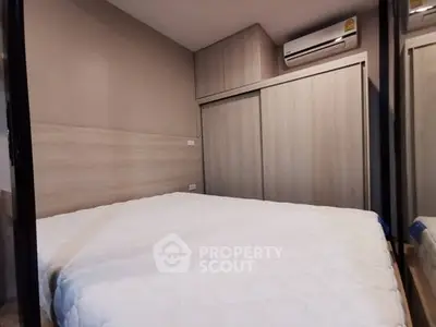 Cozy bedroom with modern air conditioning and ample closet space