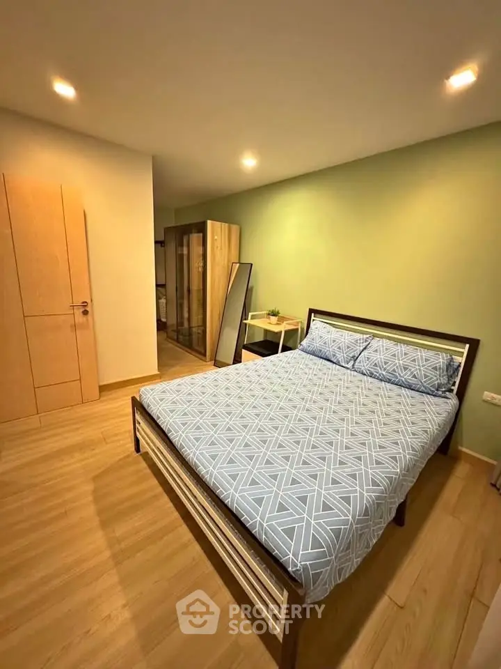Spacious bedroom with modern decor and ample storage space