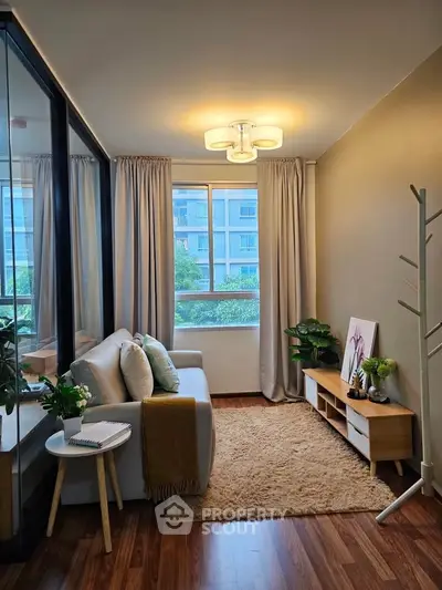 Cozy living room with modern decor and large window view