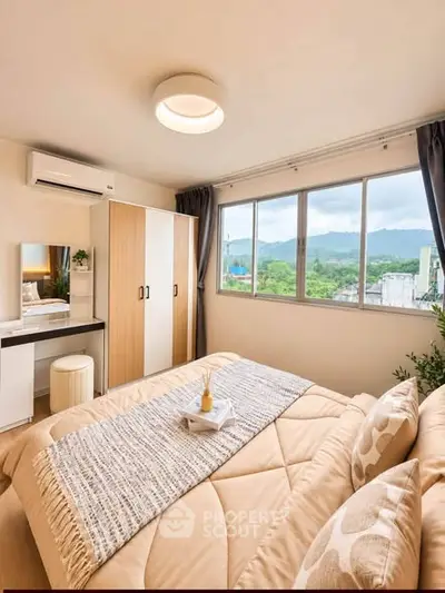 Bright and cozy bedroom with scenic window view and modern furnishings.