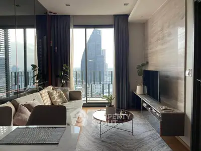 Modern living room with city view, stylish decor, and natural light.