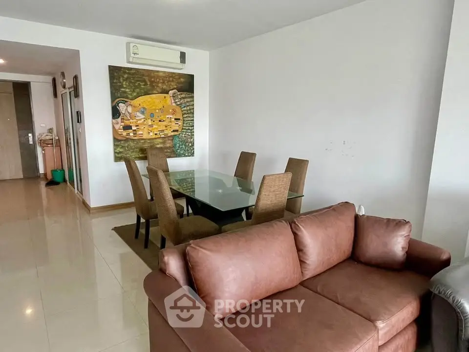 Spacious living room with modern furniture and elegant decor in a stylish apartment.