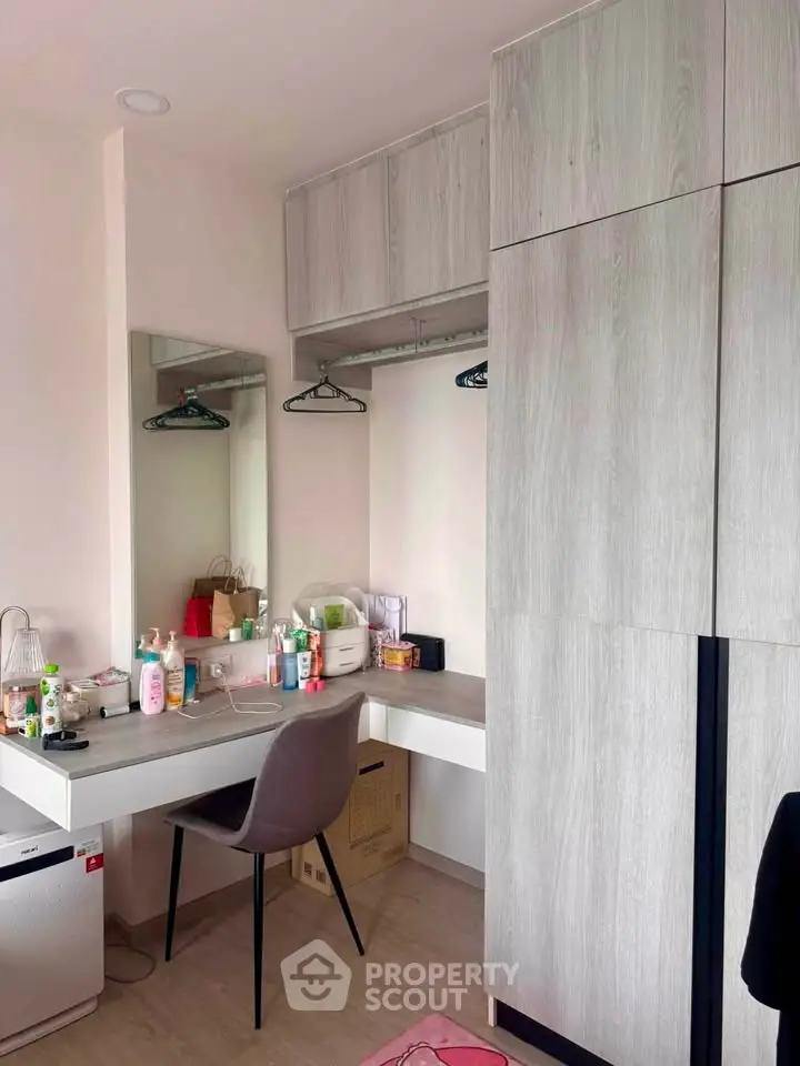 Modern bedroom with sleek wardrobe and stylish vanity desk