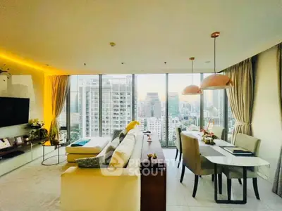 Luxurious high-rise living room with stunning city view and elegant dining area.