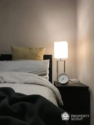 Cozy bedroom with modern nightstand and soft lighting