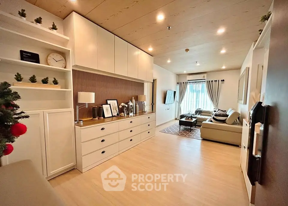 Spacious modern living room with elegant decor and ample natural light.