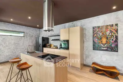 Modern kitchen with sleek island and artistic decor in contemporary home